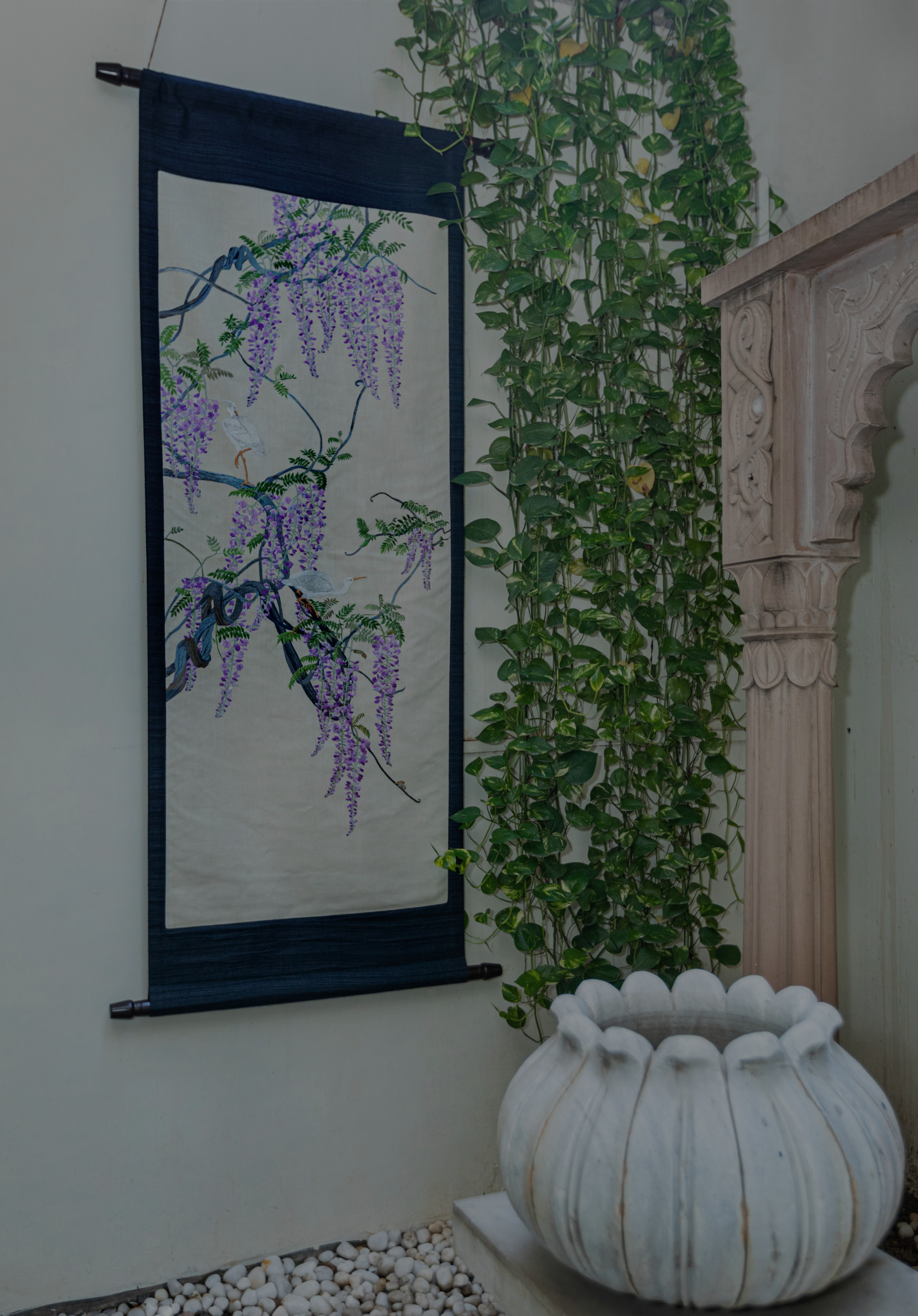 Inspired by an 18th century Meiji era embroidery tapestry of white egrets perched on climbing wisteria wines.
The fine needle work is rendered in a palette of pastel and earth tones in soft contrast to the grey brown of the tree bark.